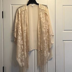 Women off-white kimono with lace and fringe.
